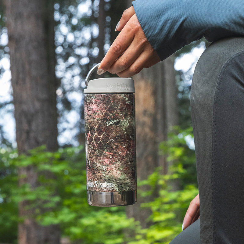 12oz-tkwide-with-twist-cap-mossy-oak-l1 12oz_tumbler_mossyoak_rainbowtrout_hand_closeup_square.jpg