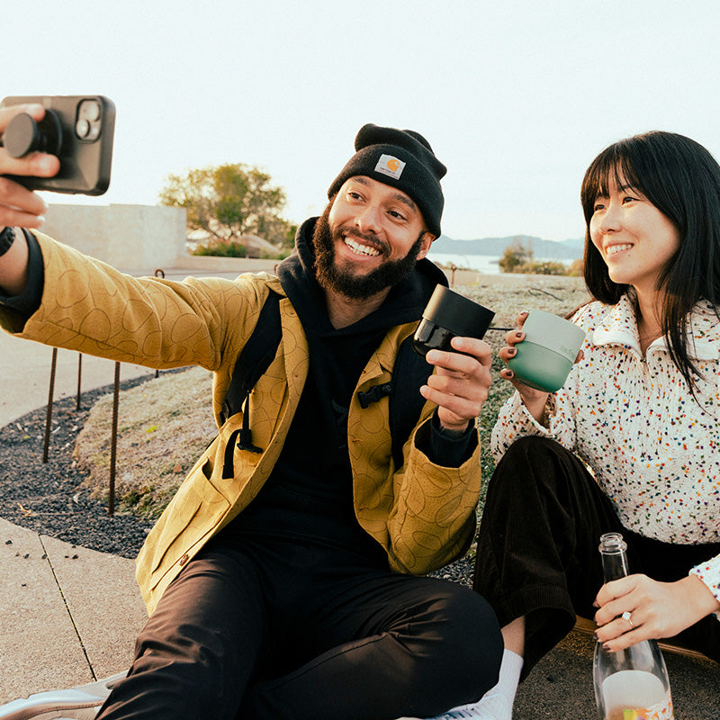 bring-your-own-party-kit-tumblers-and-cocktails-n4 8oz_rise_lowball_black_iceberg_couple_selfie_city_square.jpg