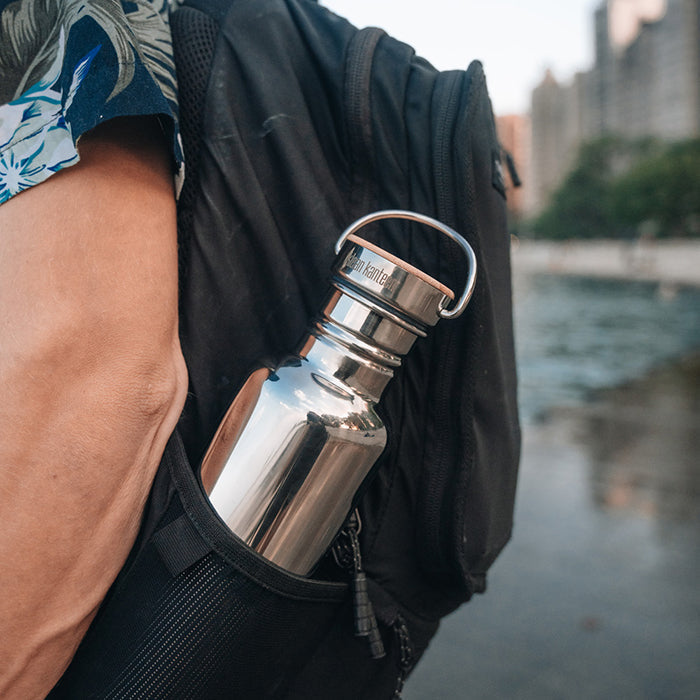 27oz-reflect-with-bamboo-cap-l0 K27SSLRF-MS-BAMBOO_reflect-bottle_backpack_lifestyle.jpg
